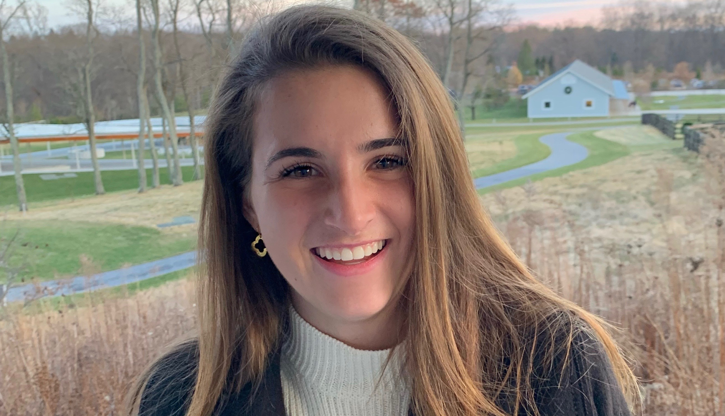 a young woman smiles