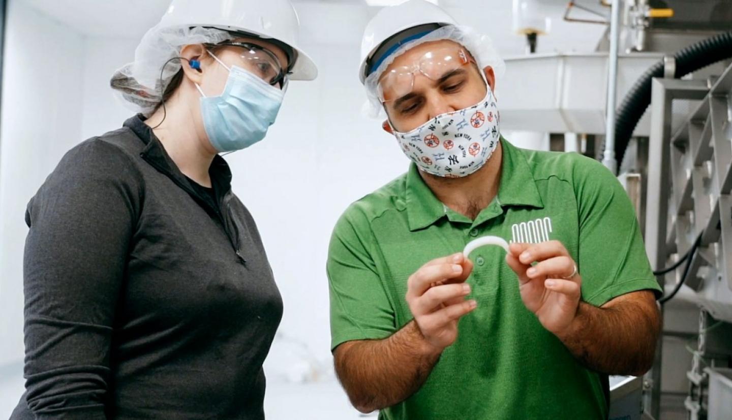 Father Farms employees looking at a french fry 