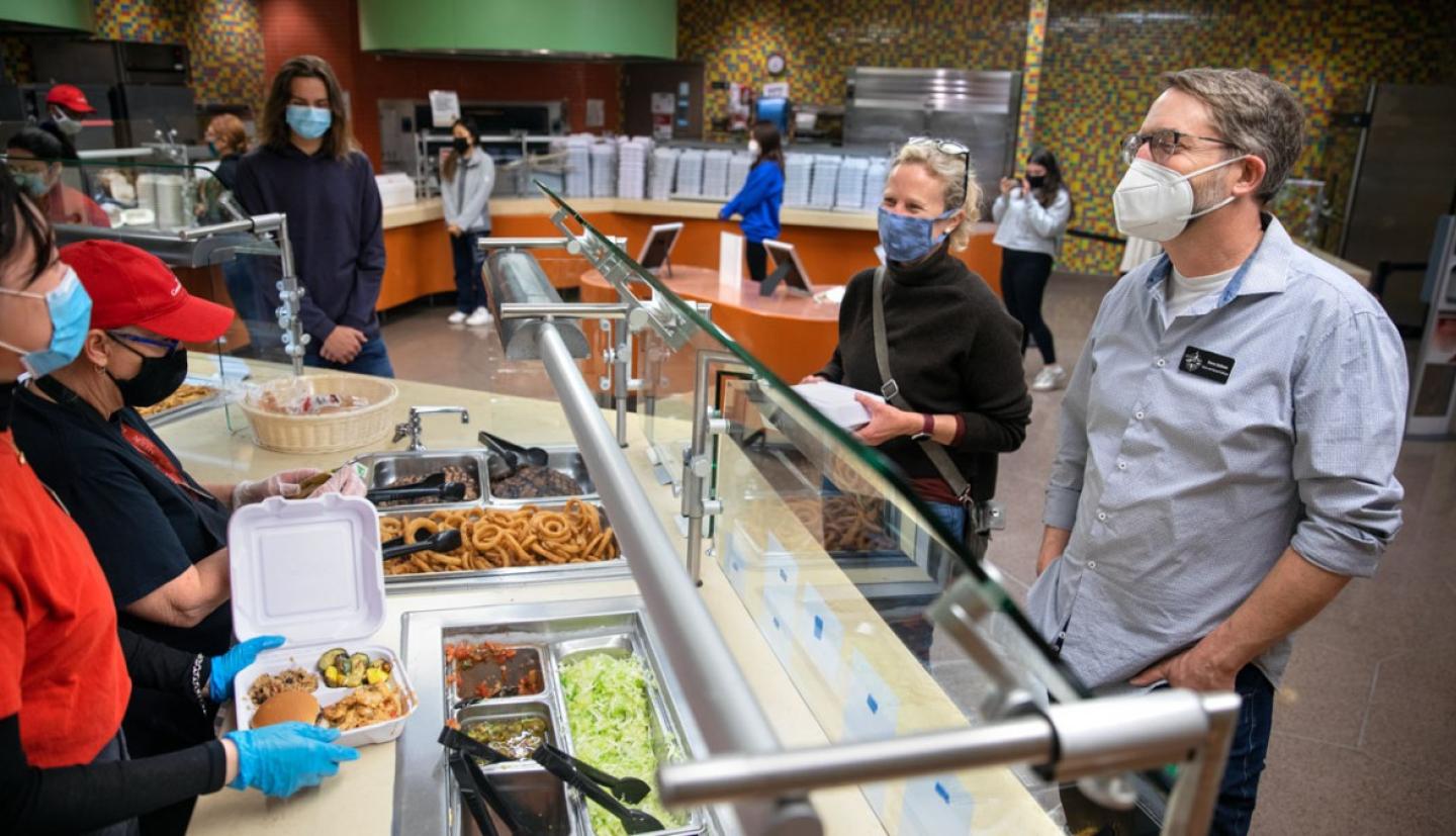 C. Lindsay Anderson and Steven Jackson in line in a Keeton House dining hall
