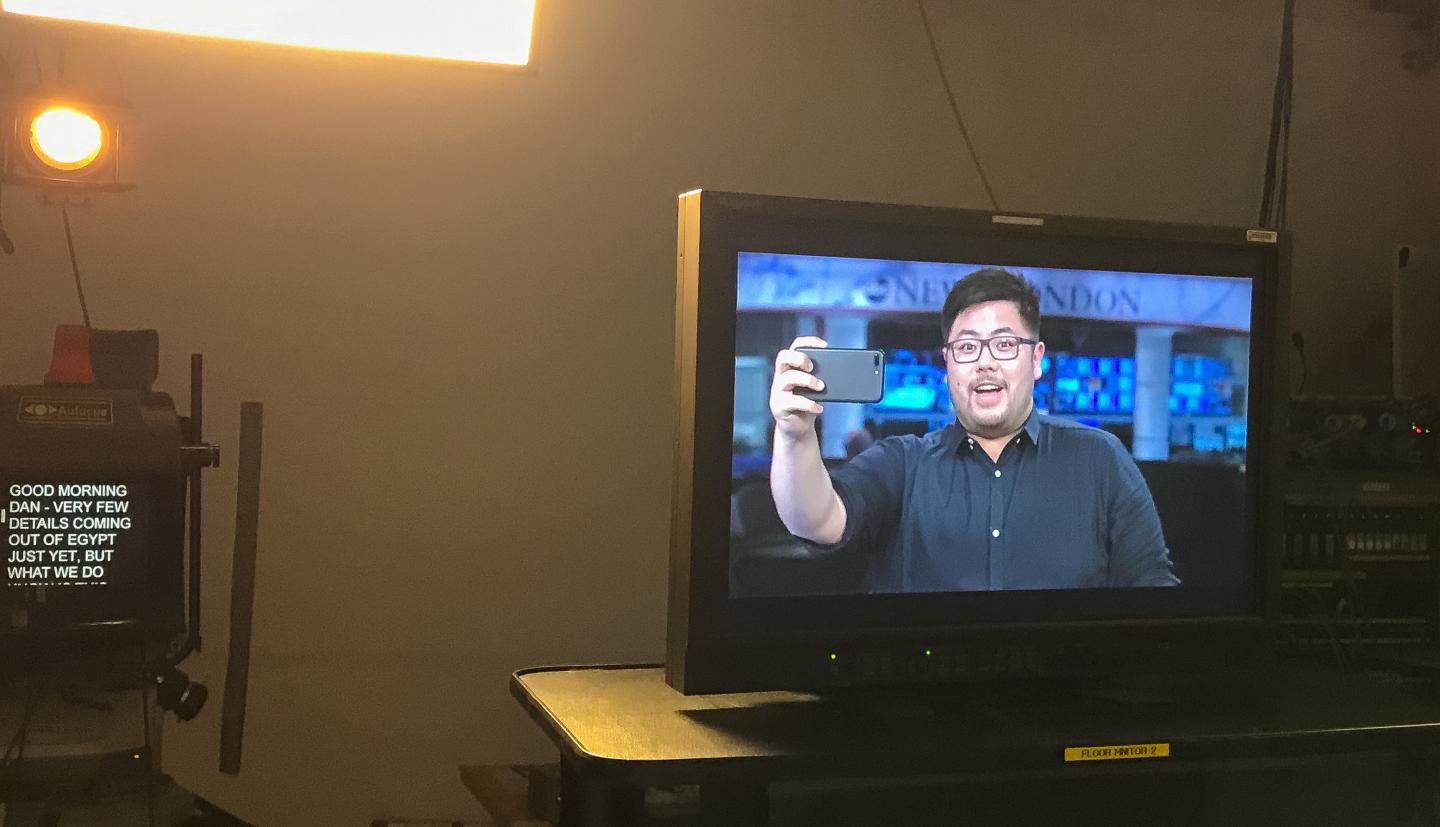 Kevin Lam takes a selfie on camera