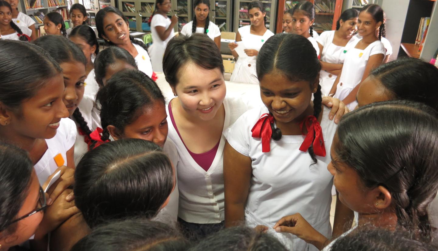 Group of girls stand in a huddle