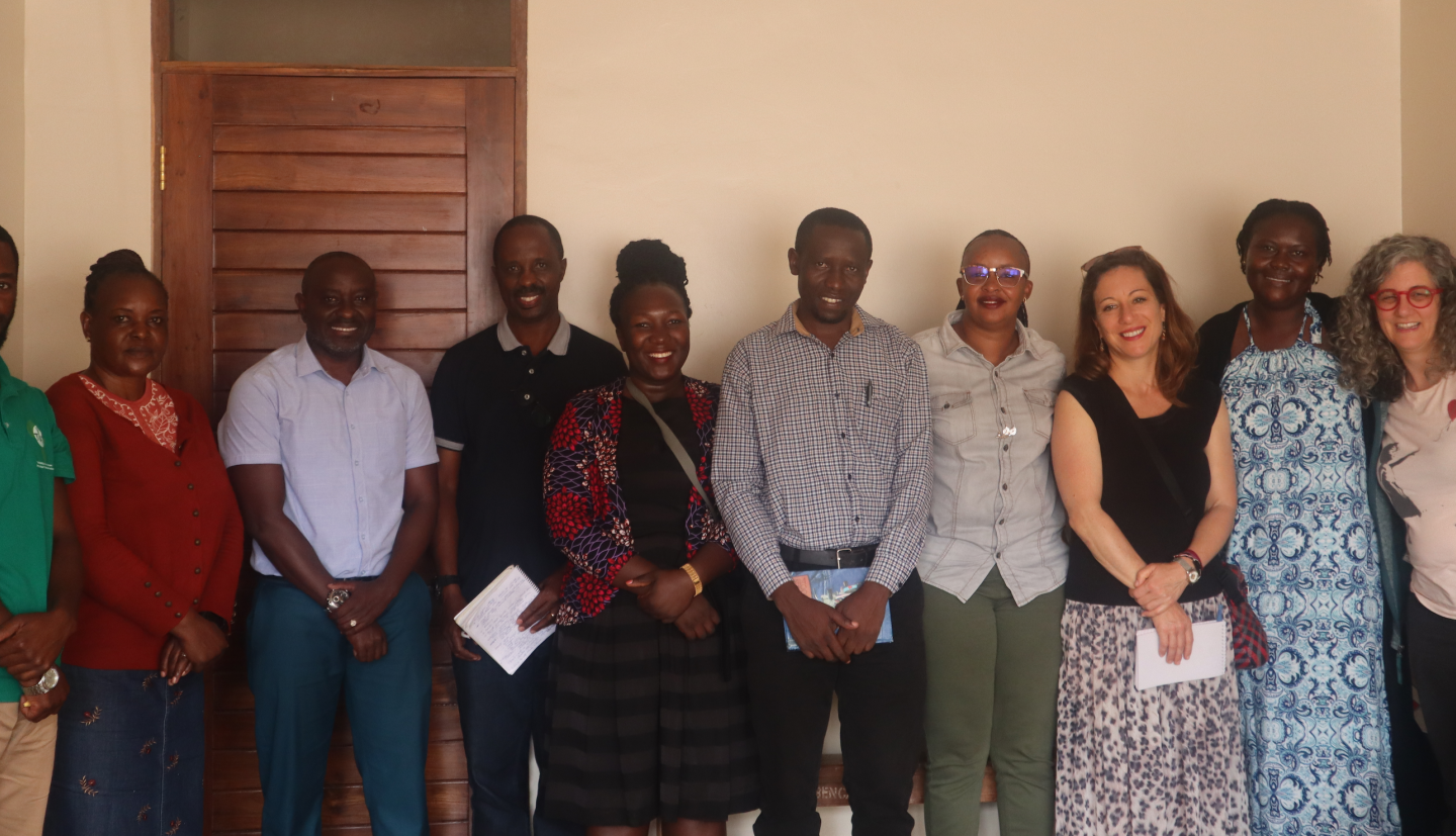 Group of team members pose for photo
