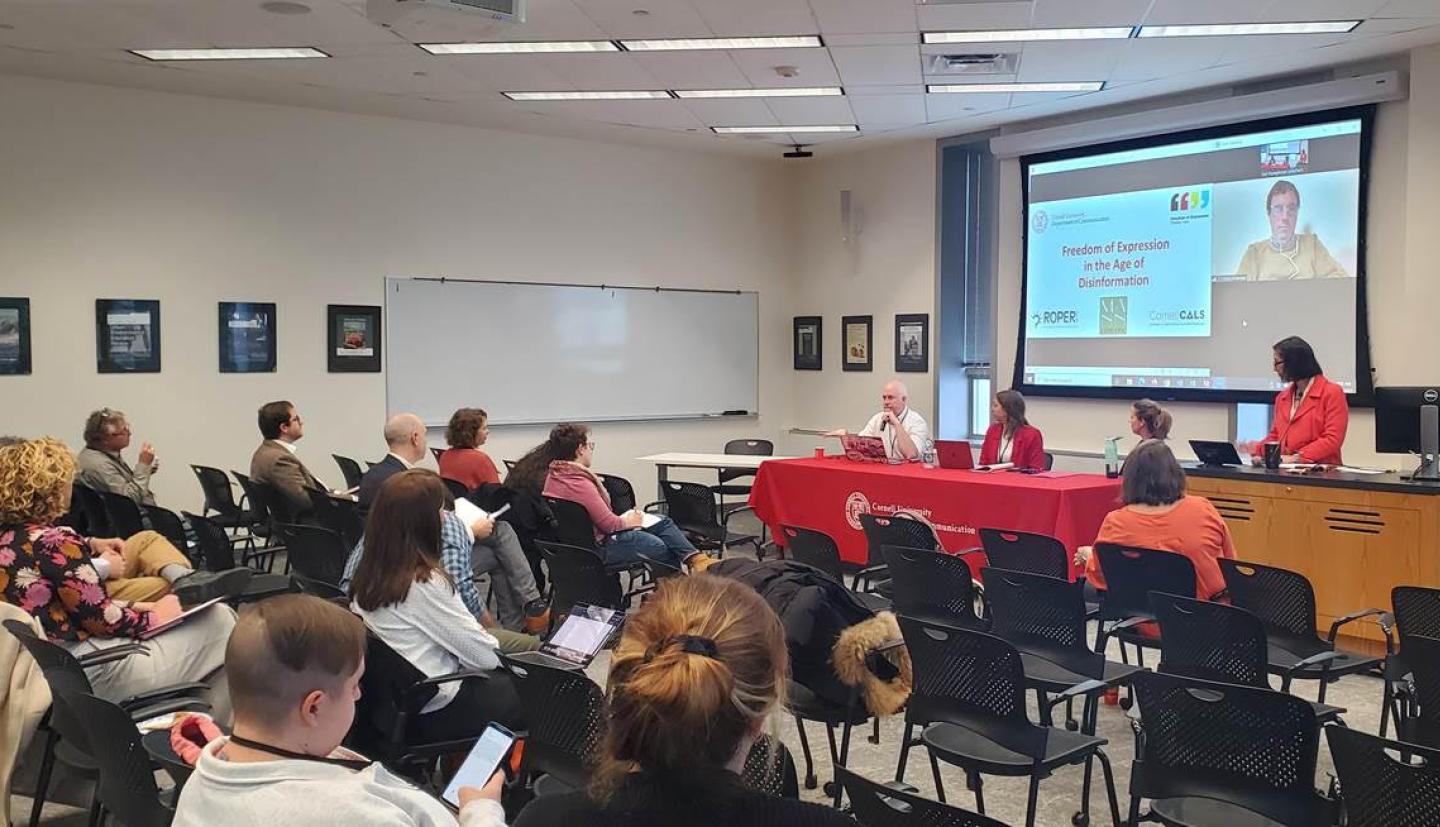 Lee Humphreys standing behind a desk giving presentation