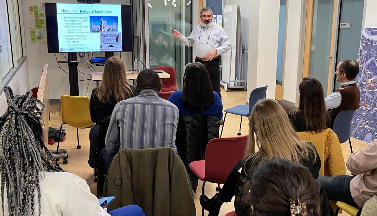 man lecturing in front of class