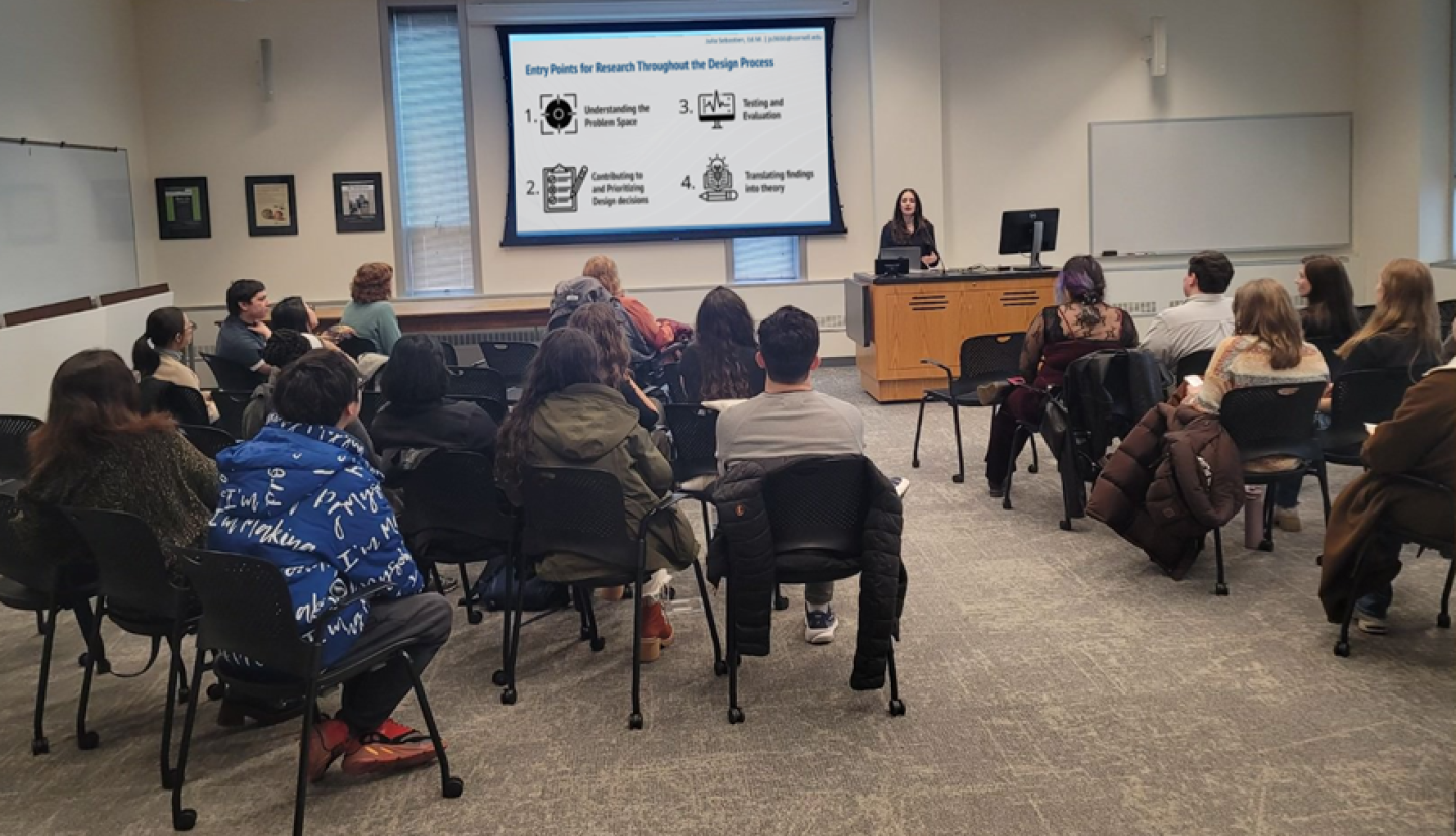 women lecturing in front of classroom