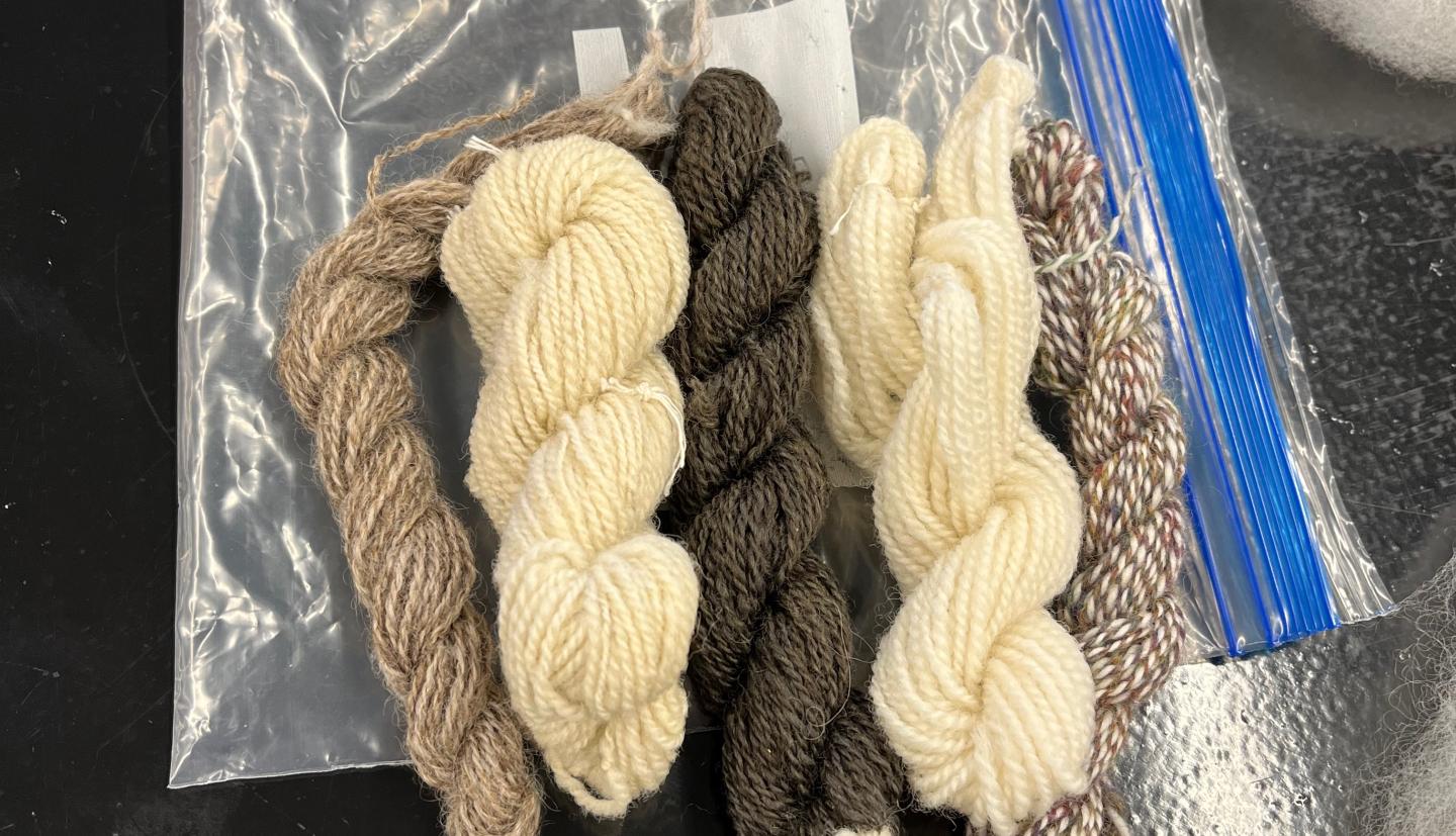 spun yarn of different colors lie on a table