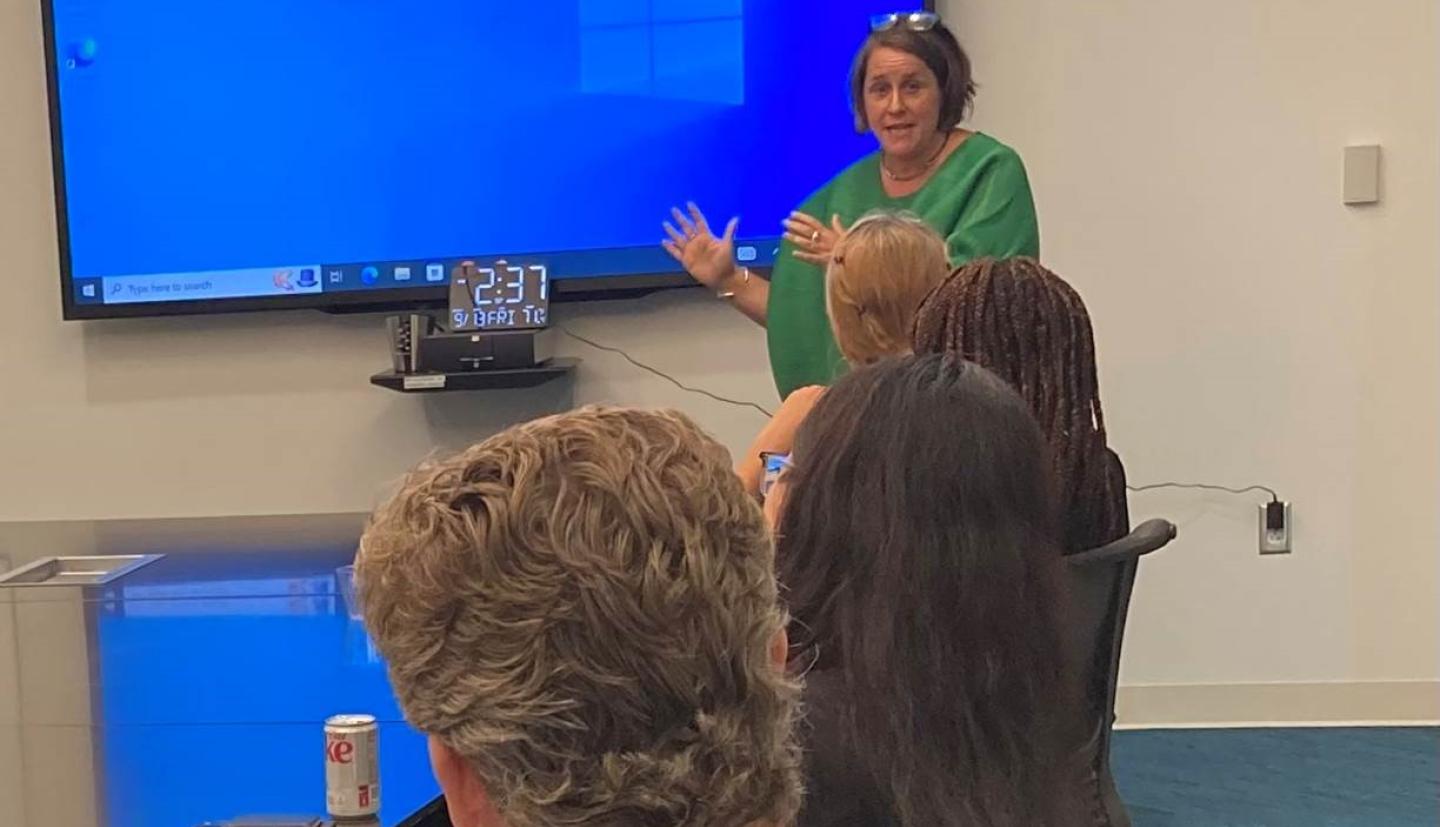 Claire Wardle stands in front of a room of people lecturing