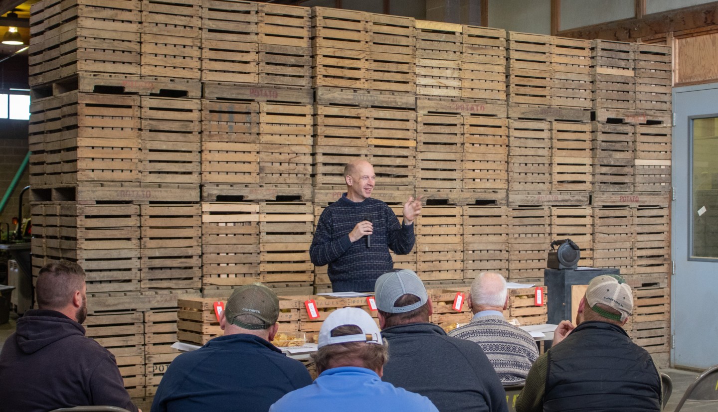 A group of people in front of crates