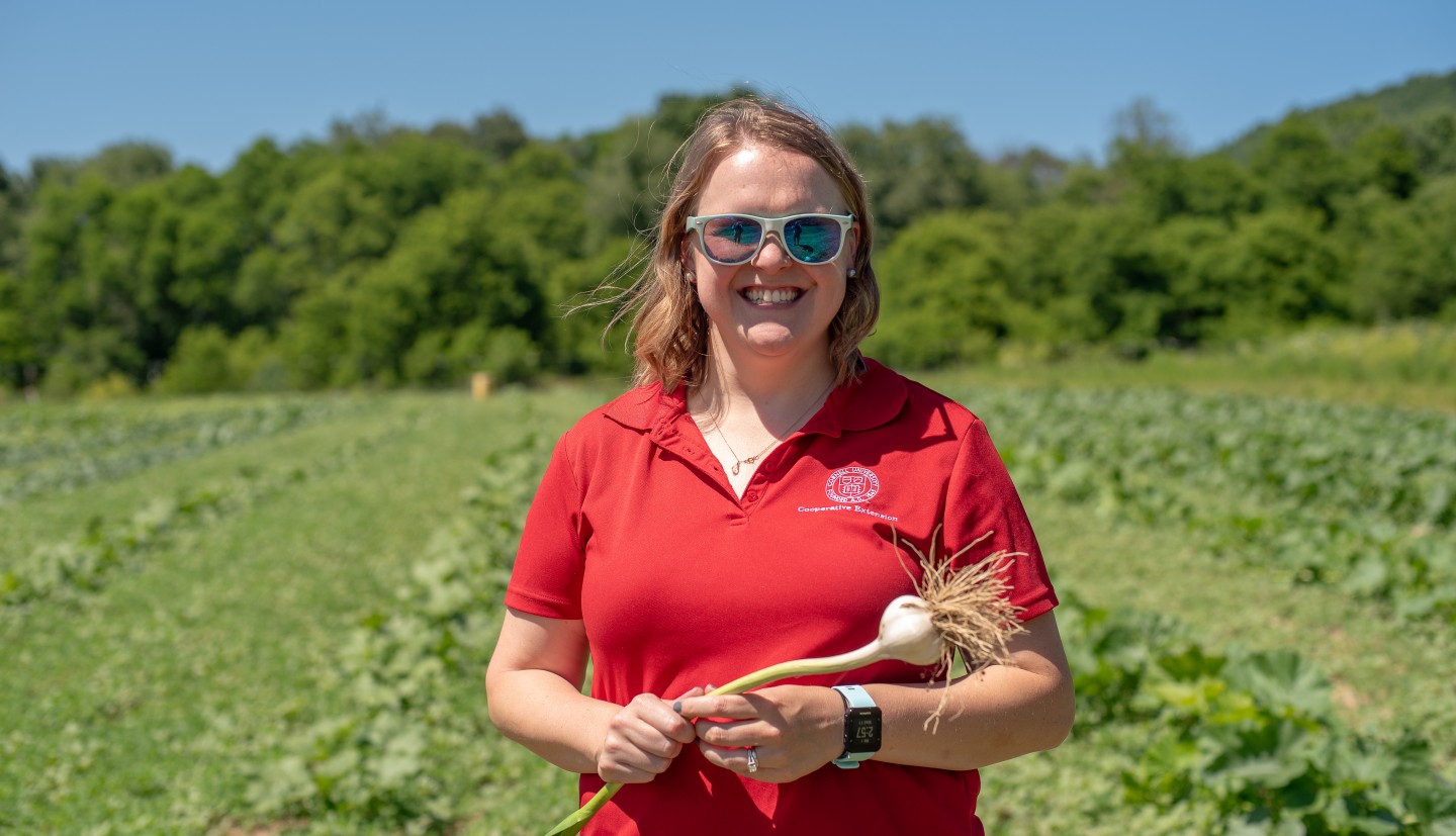 Larkin in a field with an onion