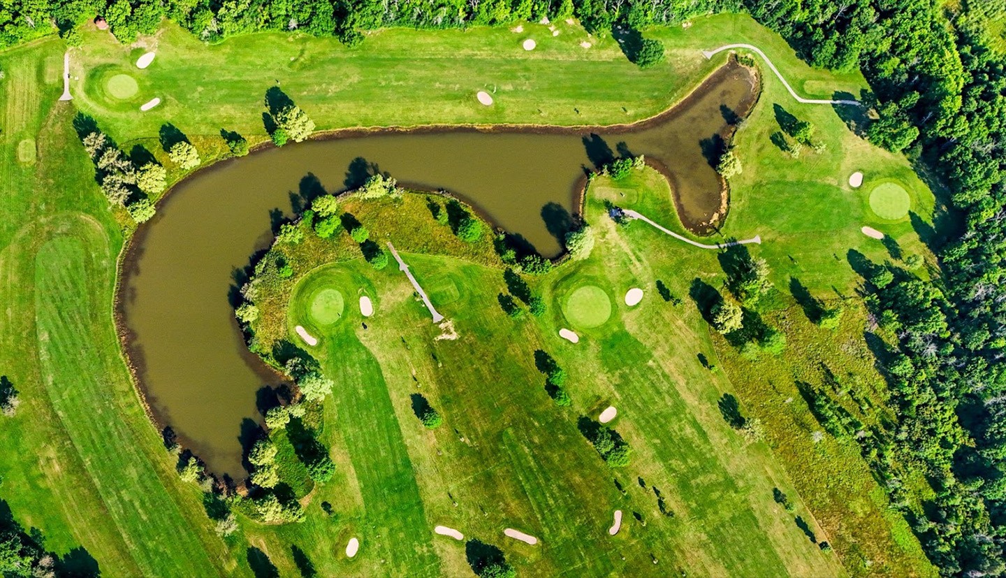 aerial view of golf course pond