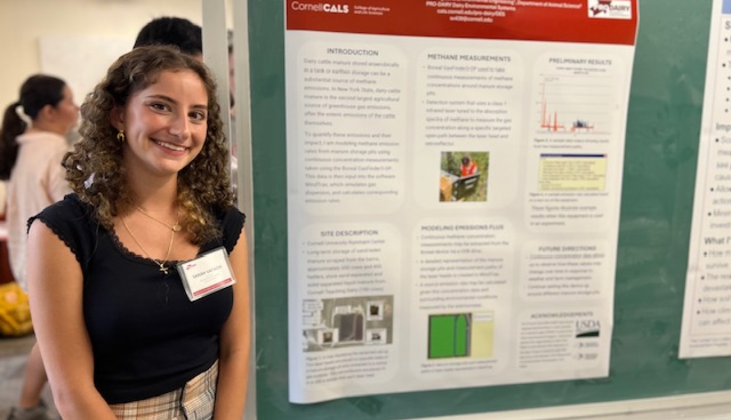 person standing by a science poster