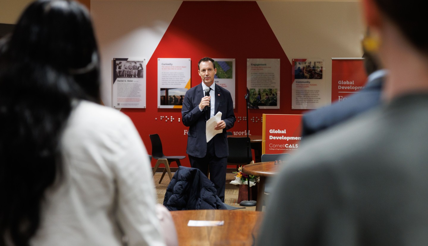 Dean Houlton addresses student at Engaged Symposium