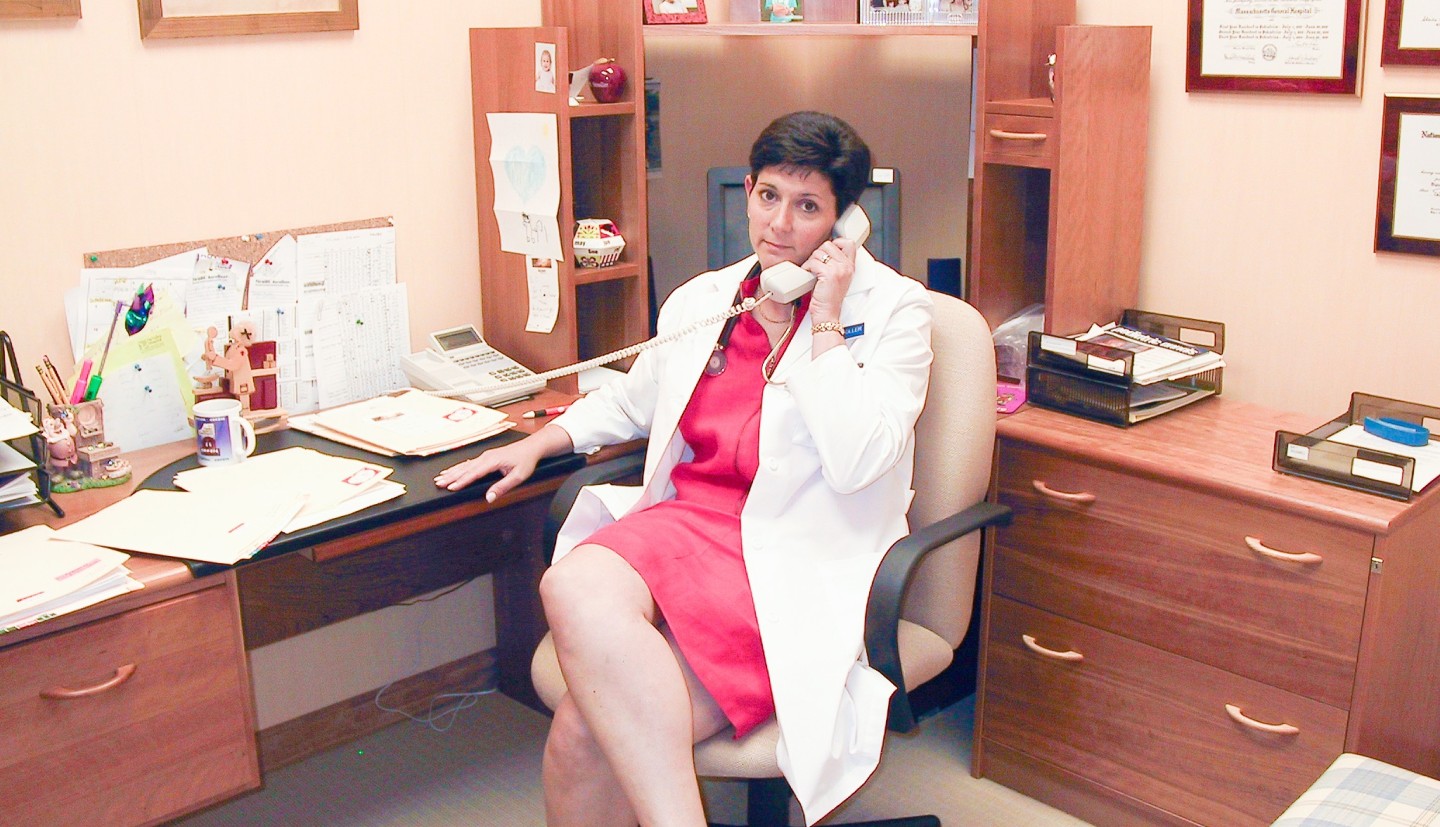Woman on phone at her desk