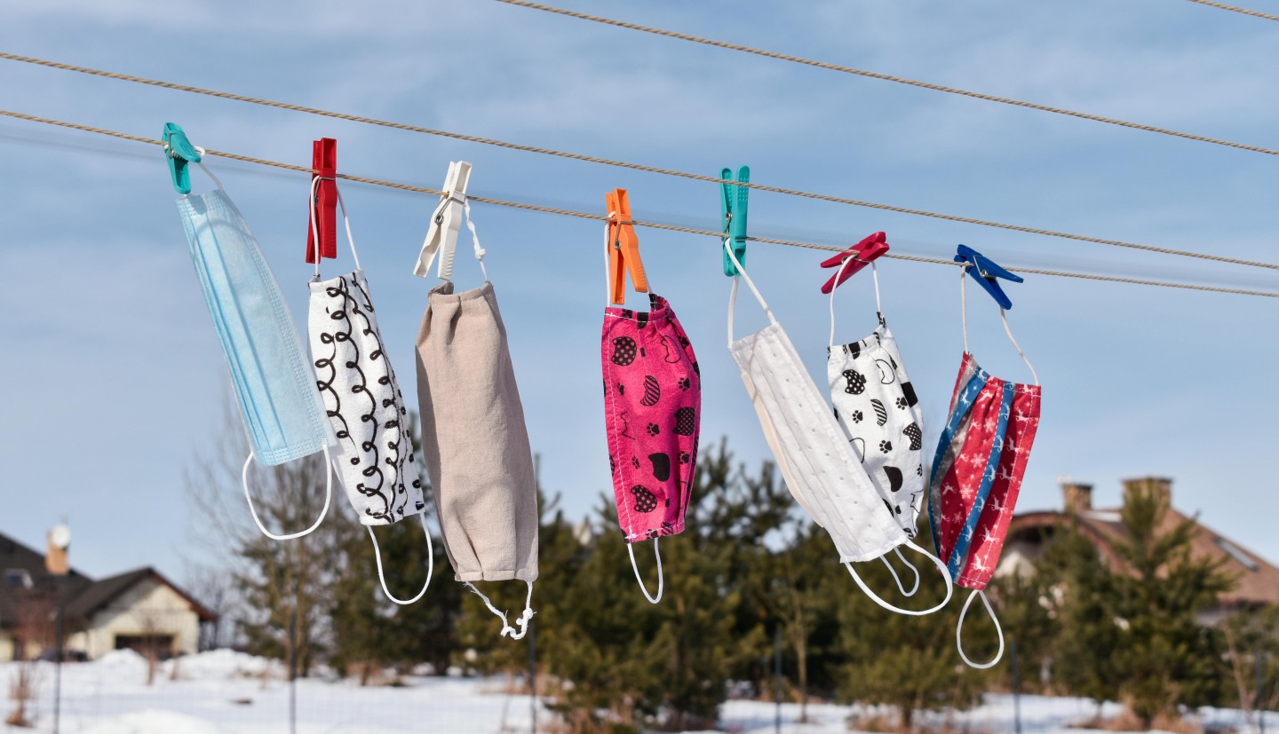 Face masks hanging to dry on the laundry line