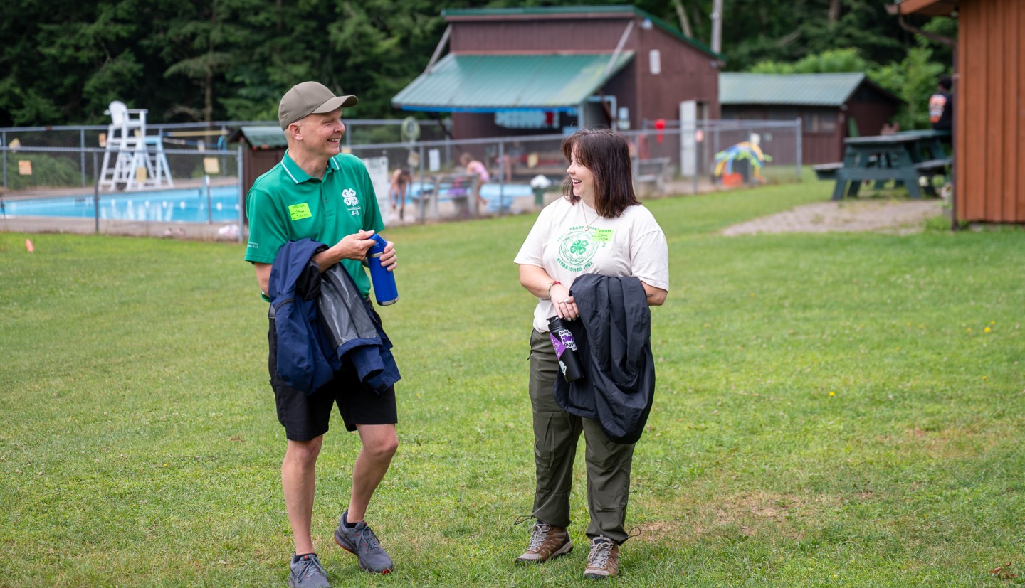 Shawn talks with a camp staffer at 4-H camp shankitunk