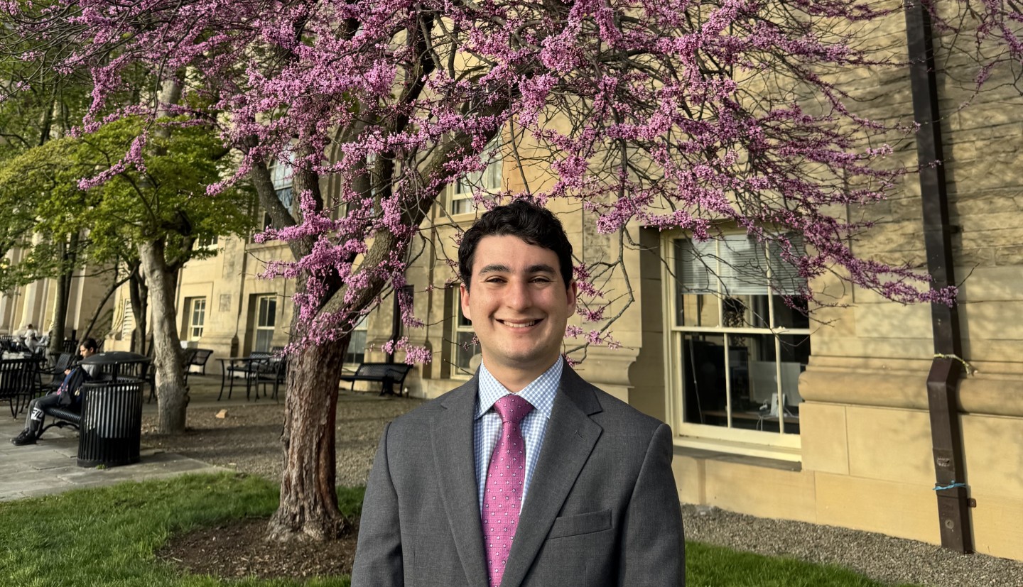 Person standing in front of a tree