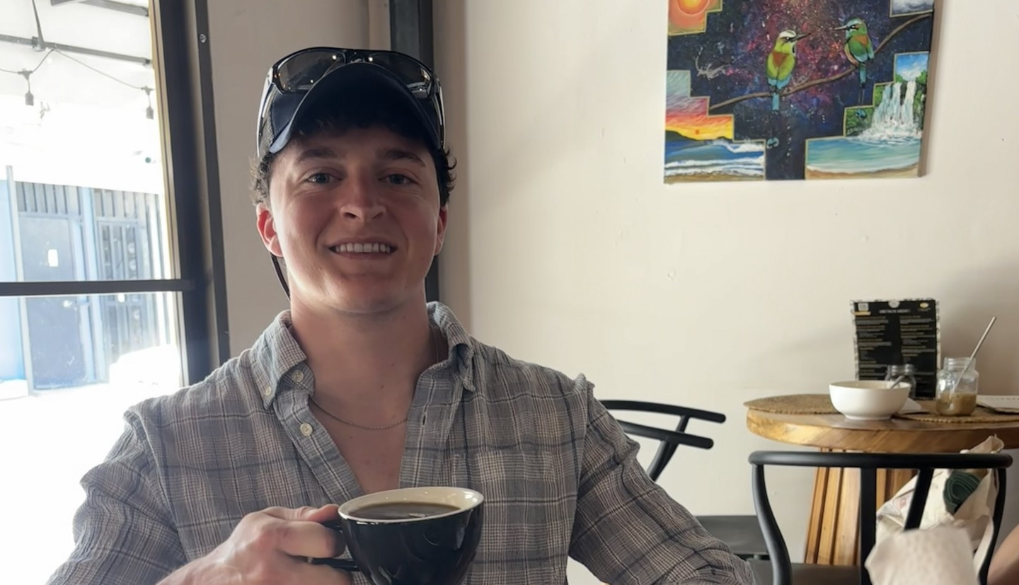 Person holding a beverage in their hand