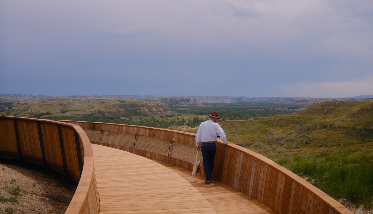 Matt McMahon walking on bridge