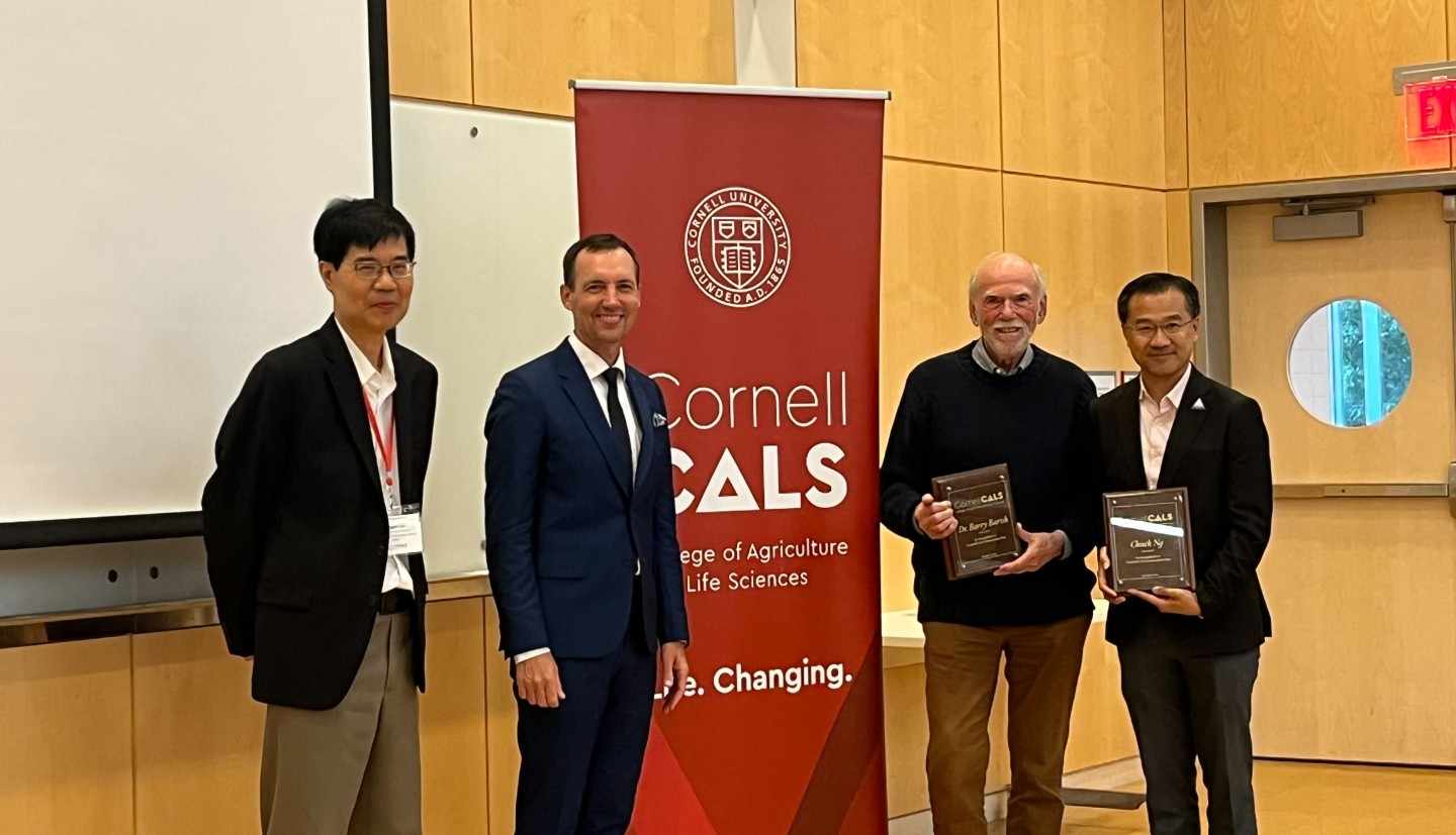 Xingen Lei, associate dean of RIO, and Benjamin Z. Houlton, the Ronald P. Lynch Dean, present plaques as an expression of gratitude to keynote speakers, Nobel laureate Barry Barish and Chuck Ng.