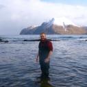 an Hewson standing in water in the Aleutian Islands, Alaska