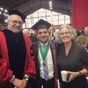 Sagar Chapagain stands at graduation with faculty and staff
