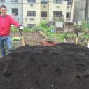 Sara Perl Egendorf standing next to pile of soil