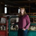 Kristan Reed standing in the cow barn