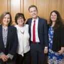 Kevin Kowalewski ’17, center, is joined by, from left, Dawn Chutkow, visiting professor of law; Cornell President Martha E. Pollack; and his mother, Julie Kowalewski