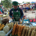 A woman cooks street-food in Thailand