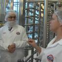 People wearing personal protective equipment in the Cornell Dairy plant