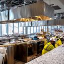workers installing equipment in the future Discovery Kitchen