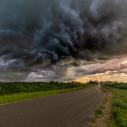 thunderstorm approaches cornfields