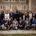 Group of Humphrey fellows pose for a photo on campus