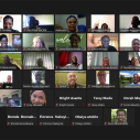 Dozens of faces appear on a Zoom video call screen