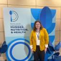 Woman attends hunger, nutrition and health conference. 