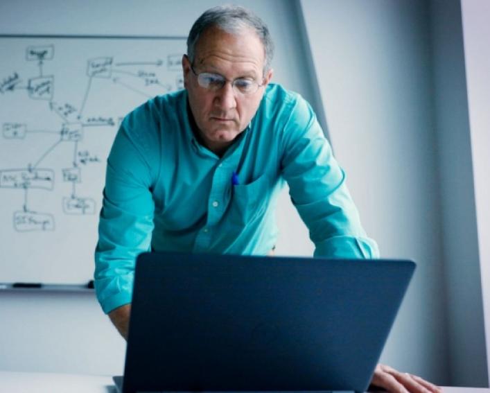 Mike Van Amburgh works at a computer