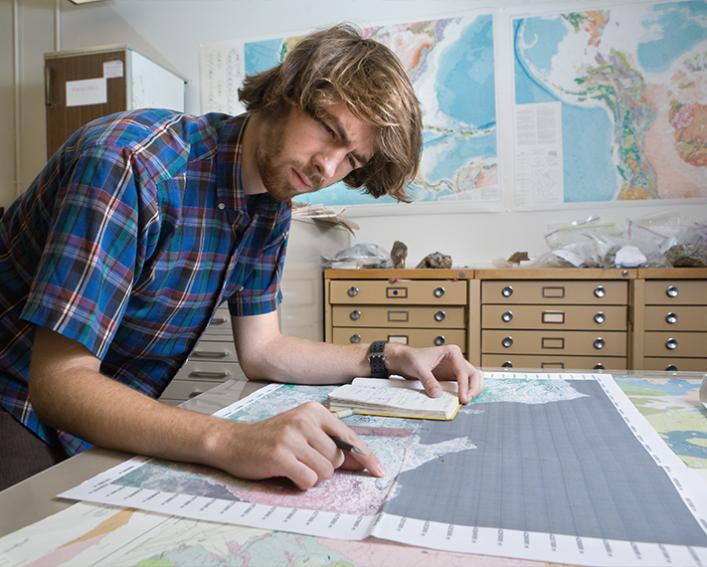 Man looking at map.