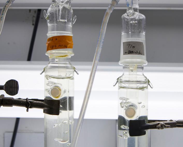 Two bottles in lab being tested.
