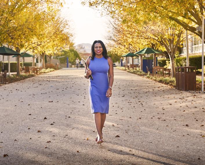 CALS Alumna Deborah Arrindell '79 walks outside the Amgen Inc. campus in Thousand Oaks, California.