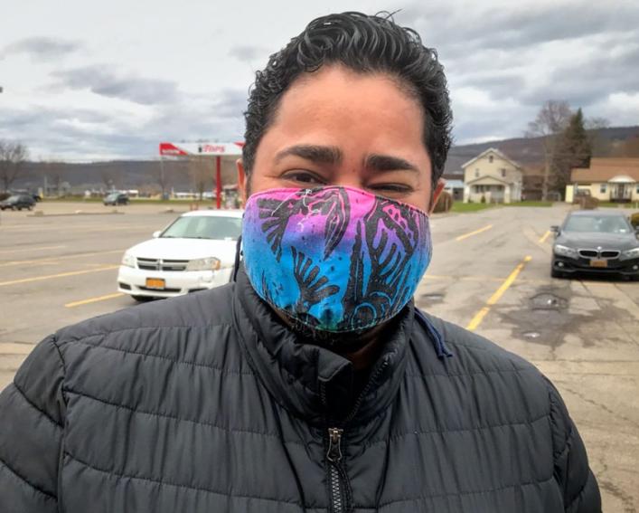 A man wears a mask outside