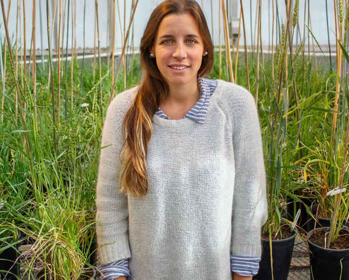 Woman standing in a greenhouse