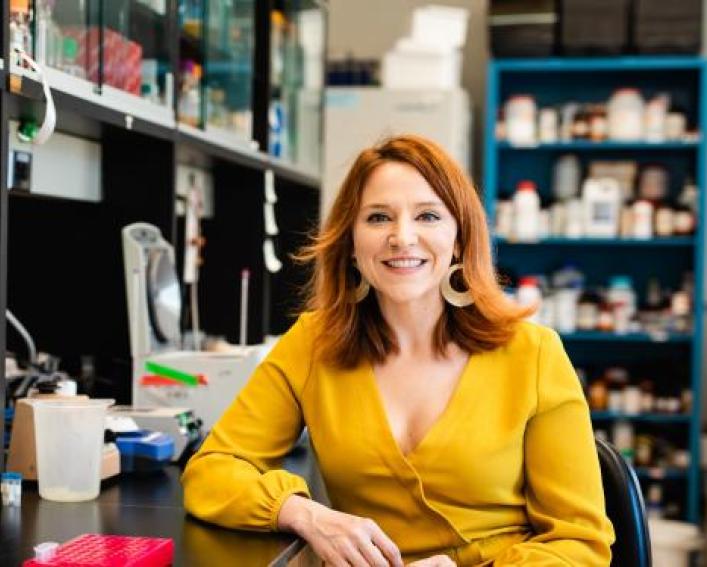 woman sitting in a research lab