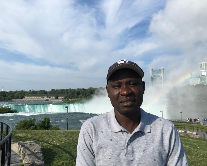 Man standing near Niagara Falls
