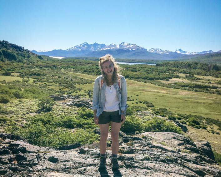 Hannah Fuller stands in front of the Patagonia mountains