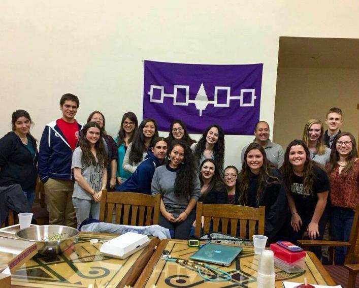 Residents and members of Akwe:kon pose for a group photo in the house.