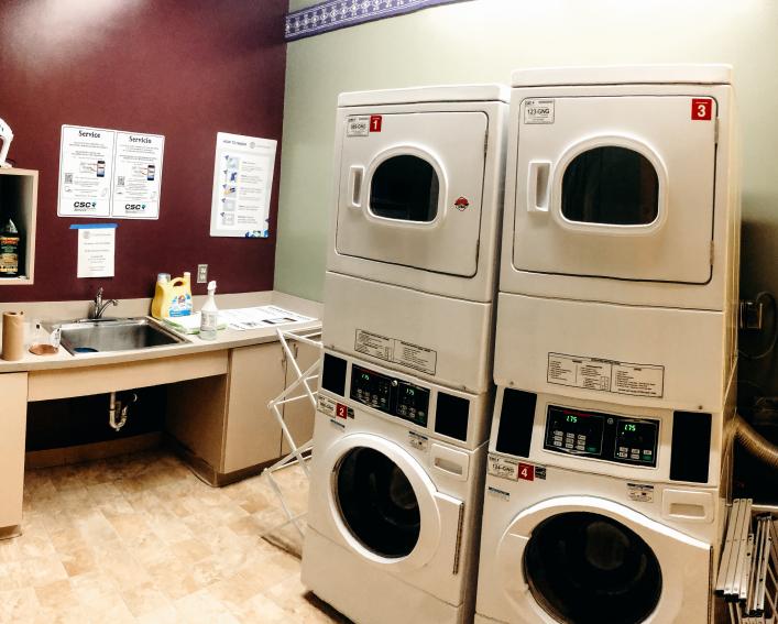Akwe:kon laundry room includes two washers, two dryers and sink.