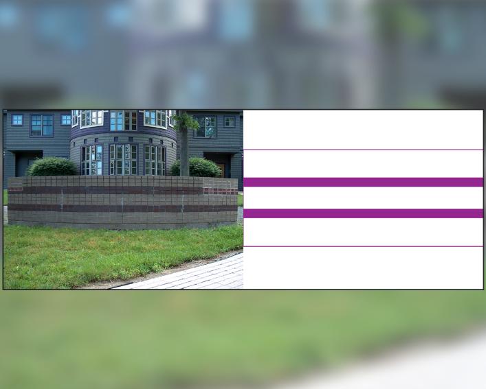 A stone wall in front of the Akwe:kon house depicting the two row Wampum belt