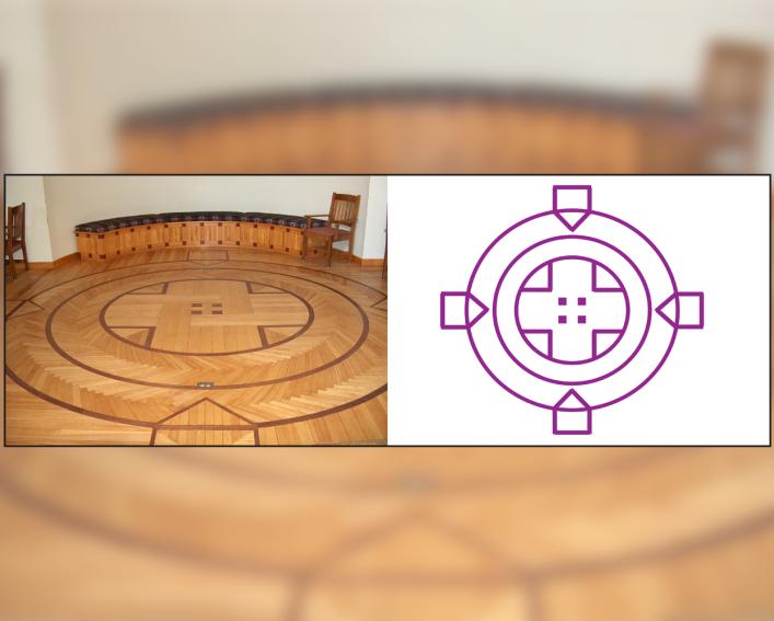 The inlaid motif on the hardwood floor forms three circles and four points.