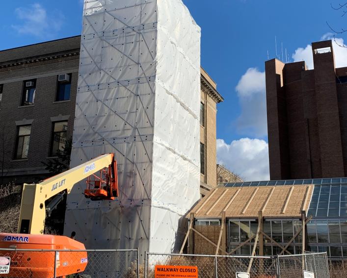 building with construction machinery