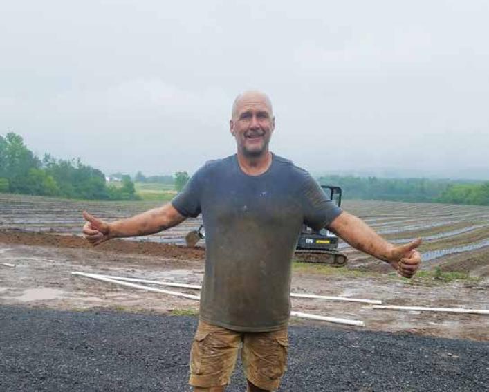A man in a wet field